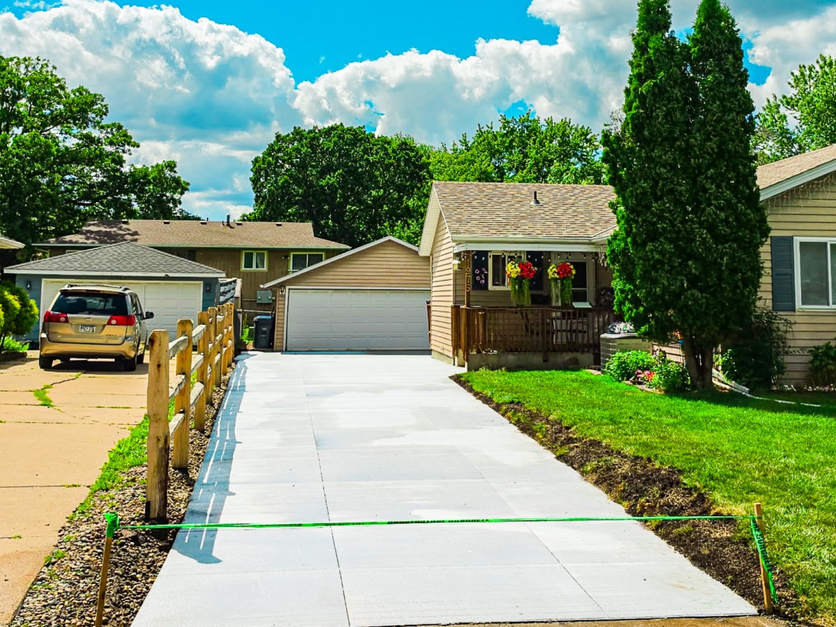 New concrete driveway installed at a lakeside home in Shoreview, MN